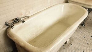 Old bathtub showing how long does tub refinishing last